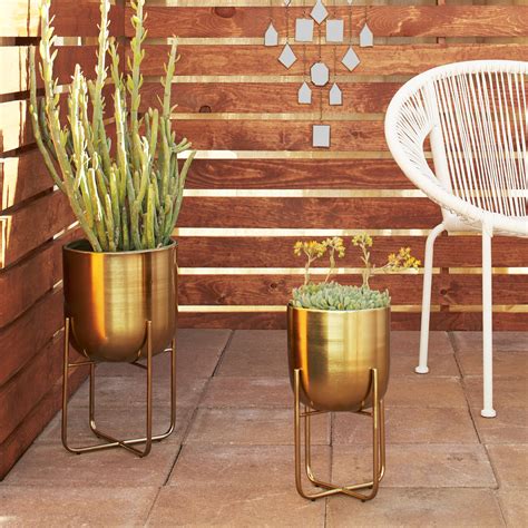 gold planters indoor|decorative gold plant stand.